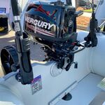 Railblaza Sideports in black stern mounted as rod holder socket.